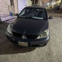 لانسر 2011 محرك 1600 السيارة جاهزة من كلشي تبريد محرك كير تاايرات  غرف...