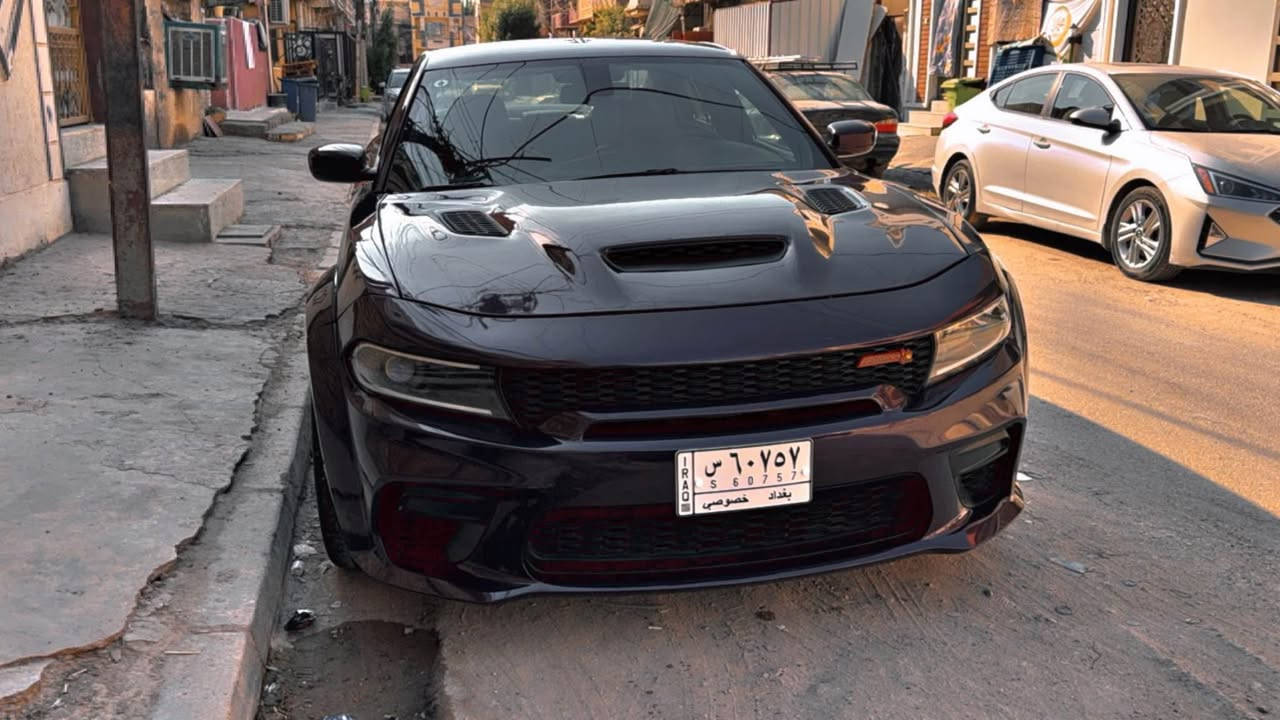 دوج جارجر سكات باك وايد بدي للبيع او مراوس 
‎الموديل:2022 . 
‎المحرك : SRT . V8 . 6.4L .
‎العداد : 25 الف ميل ) .
‎ المواصفات :
‎* وايد بدي . 
‎* مكابح رياضية (برمبو) . 
‎* لايت LED . 
‎* نقطة عمياء . 
‎* كاميرا خلفية . 
‎* امكانية التحكم بوضعيات المقود كهربائيا . 
‎* كزوز سستم . 
* ولف حماوة ريسنك 82 
* اويل كاج كان 
‎* حساسات خلفية . 
‎* ويل قياس 20 أنج 
‎* سستم صوت ALPINE . 
‎* تشغيل عن بعد . 
‎* مقاعد رياضية من الجلد الفاخر . 
‎* ذاكرة لحفظ وضعيات الجلوس (ميموري) . 
‎* المقاعد الأمامية تبريد وتدفئة . 
‎* نظام خرائط GPS . 
‎* شاشة كبيرة قياس 8.4 أنج اوپشنات SRT 
‎* تدفئة ستيرن . 
‎* كير شفتر بالستيرن . 
‎* بلوتوث تلفون . 
‎* محدد سرعة .
السيارة مبرمجة يم مصطفى ايكل 
رقم التليفون 
*********** بغداد, العراق

نص مكتوب في الصور:
- الدليمي 1:36 PM