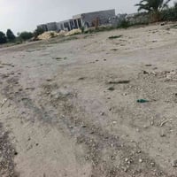 ٣ دونمات • ٢ بيت • قرب المصب العام