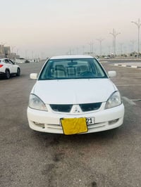 لانسر ٢٠١٠ • مكفولة • رقم كربلاء