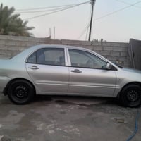 لانسر 2004 رقم انكليزي بابل  كير محرك تبريد كهربائيات خير من الله  مصب...