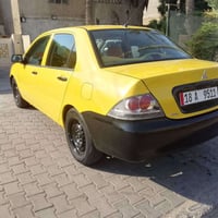 شباب لانسر موديل 2010 شركة عامه مكفولة من الضربه بيها صبغ قطعه فقط ودو...