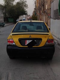 لانسر ٢٠١٠ • مكينة ٢٠٠٠ • رقم بغداد دولي