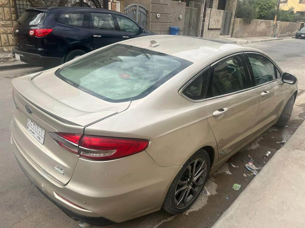 سيارة فورد فيوجن 2019 وارد امريكي (للبيع فقط )
الموصفات : 
- SEL(SEL )فوووول فووول  مواصفات للاخير 
-محرك 1500 تيربو
- كشنات جلد كهربائي بلادي  
- خزن ميموري مقعد السائق 
- حساسات امامي وخلفي ويمين ويسار 
- الصندوق كهربائي بصمة 
‏-  الابواب بصمة 
- باسورد باب السائق 
- التشغيل بصمة 
-تشغيل عن بعد 
-شاشة كبيرة وايضا شاشة ملاحة 
-كامرة دوارة وحساسات توقف ذاتي 
- اوتو هولد 
- هاند بريك كهربائي 
‏-الايرباكات كلهة سليمة
-ضربتهة بأمريكا جاملغ خلفي 
السيارة خير من الله دينار ما تتصرف عليهة 
اقتصادية بصرف البانزين
رقم بغداد بأسمي تحويل مباشر 
السعر :108$  وبيهة مجال تدلل
صور الحادث موجودة بالمنشور 
للاتصال على الرقم  ***********

