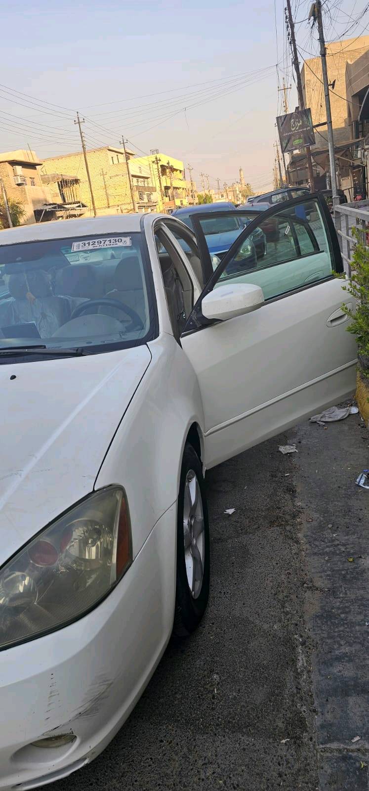 نيسان التيما رقم بغداد انكليزي باسم زوجتي السعر 70وبي مجال قطعتين صبغ دون معجون بنيد منكرش خفيف حدادية جديدة دبلات جديدة باتري جديد تخم تاير جديد غرفة نظيفة تبريد قطعتين امامي خلفي لايت زنون عالي ناصي مال مونيكا مكاني بغداد محمودية
شنو سنة الموديل وعدد الكيلومترات الممشاية؟: 
2007
شنو نوع المكينة والكير بالضبط، وهل بيها أي ملاحظة على القير أو المكينة؟: 
2400
هل السيارة عليها صبغ غير المذكور أو بيها رش/معجون بغير الأماكن المعلنة؟: 
لا
وين مكان السيارة للتفقد؟ وهل السعر قابل للتفاوض بشكل بسيط لو نهائي؟: 
بغداد محمودية نعم قابل للتفاوض 
شنو وضع التسجيل والملكية: رقم بغداد إنكليزي وباسم زوجتك، وهل الأوراق كاملة وجاهزة للنقل؟: 
نعم