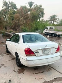 نيسان سني ياباني ٢٠٠٩ بدون صبغ بيهه فقط بارد بنيد وباب خلف سايق   مري ...