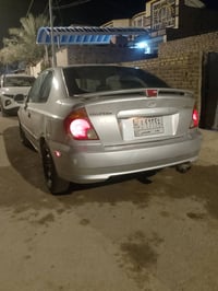 اكسنت 2005 تك باب مراوس اربعه راكب رقم بغداد دوشمه وعازل وحداديه جديده...