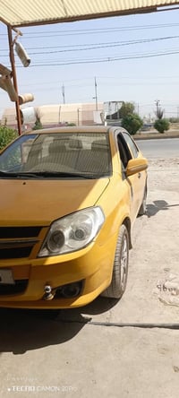 جيلي MK • 2010 • مكينة كورلا
