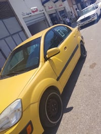 كيا ريو 2008 رقم ألماني بغداد محرك 16منظومة غاز تبريد  جام عادي ضرر جا...