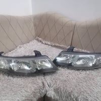 زوج لايت كيا سيراتو مال موديل ٢٠٠٨ لحد ٢٠١٢ يرهم لايتات اصليات بس جاما...