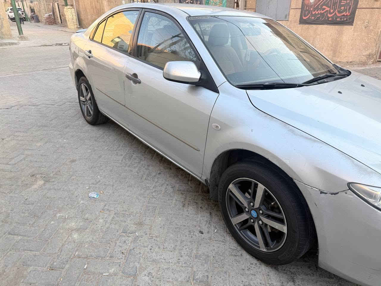 مازدا ياباني وارد خليجي اوتماتيك 
زوم 6 موديل 2003 محرك 2000 
رقم بغداد 
سيارة بلادية بدون صبغ 
محرك كير خير من الله
مشط ستيرن جديد 
كهربائيات كلهة شغالة
تبريد شغال 
مكانهة بغداد 
سعر 44 
هاتف ***********
