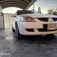 لانسر ياباني اصل  2006  داخل عسلي نضيف  كتلوكات الشركه بيها   كير محرك...