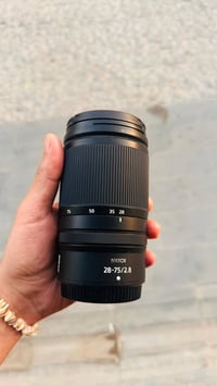 عدسه نيكون zll  فتحت العدسه 28/75 عدسه جديد بس مستعجله عليها يشهد الله...