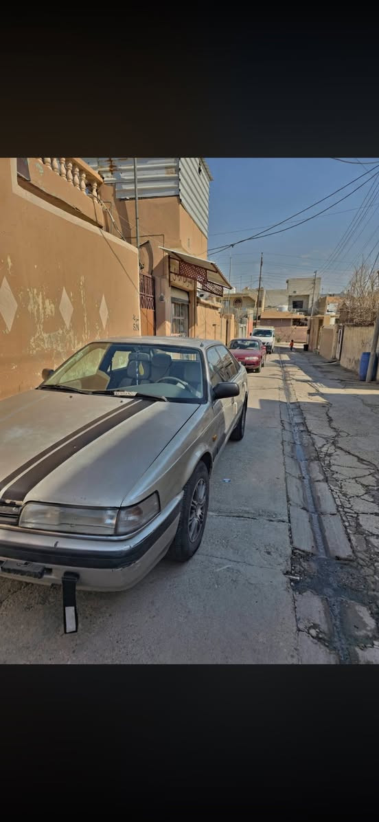 للبيع او مراوس بأحدث مازدا 626 موديل 1988 (طخم فول ونظافة مال بيت)
المحرك: 12 بخاخ (بشرط الفحص).

​الكير: أوتوماتيك (بشرط الفحص).

​التبريد والتدفئة: شغالين 100%.

​

​الداخلية: طخم بطاين أبواب جديد + كشن هيتر (تدفئة) للسائق.

​التحكم: تحكم ستيرن (أغاني) + بصمة تشغيل + تشغيل عن بُعد واطفاء عن بعد 

​التقنيات: شاشة وكاميرا خلفية + كيج قياس ضغط التايرات بالشاشة.

​الخارجية: لايت (عالي/ناصي/سكن) زينون + زوج تايرات جديد.

​الكهربائيات: كاملة وما محتاجة أي شغل.

​نشرة داخلية 12 لون تعمل 

بيها بعض النواقص البسيطة فقط 

​السيارة باسم ولد من الموصل سنوية عظم  لغاية 2027.

​السعر: اتصل على الرقم *********** او راسلني وتدلل
