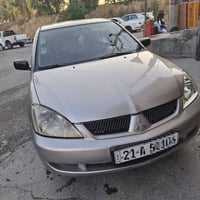 لانسر ٢٠٠٧ • دهن كامل • كفرات جديدة