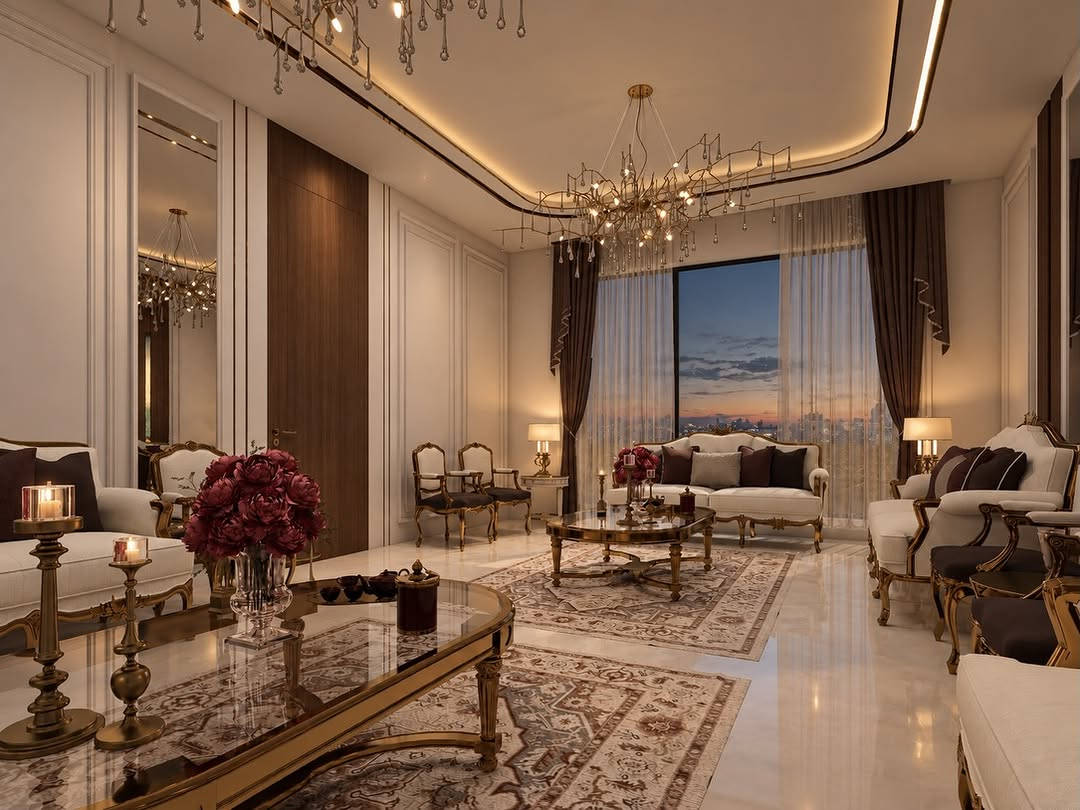 تصميم نيوكلاسيك لاستقبال ضيوف، يجمع بين الفخامة والدفء ضمن أجواء متوازنة وأنيقة.🤍✨
اعتمد التصميم على الخشب الطبيعي، المرايا، التفاصيل الذهبية، والأقمشة بدرجات البيج والبني الدافئ، مع لمسات ناعمة من الثريات والأعمال الفنية.

تصميم المهندسة المعمارية ماريا عماد عزيز
مكتب العمران الهندسي

A refined Neo-Classical guest reception, designed with a balance of timeless elegance, warmth, and comfort.

Designed by Arch. Maria Imad Azeez
Al-Omran Engineering Office

نص مكتوب في الصور:
- MOOD BOARD NEW CLASSIC LIVING ROOM A timeless blend of classic elegance and modern refinement, featuring luxurious textures, warm neutrals, and sophisticated details for a graceful and inviting living space. CLASSIC DETAILS LUXURIOUS ACCENTS ELEGANT LIGHTING
- POLISHED MARBLE FLOOR
- RICH WALNUT PANELING
- GILDED BRASS TRIM
- CREAM SOFA FABRIC
- BURGUNDY ACCENT VELVET
- TRADITIONAL RUG TEXTURE
- LIVING ROOM DESIGN PROPOSAL TIMELESS ELEGANCE IN EVERY DETAIL FITMENT SELECTION 3-SEATER SOFA Material: Solid wood + fabric Finish: Antique gold leaf Approx. size: 240 x 100 x 95 cm Style: Classic / Neoclassical ARMCHAIR Material: Solid wood + fabric Finish: Antique gold leaf Approx. size: 75 x 80 x 100 cm Style: Classic / Neoclassical COFFEE TABLE Material: Marble + metal Finish: Gold plating Approx. size: 175 x 90 x 45 cm Style: Classic / Elegant CHANDELIER Material: Brass + crystal Finish: Antique gold Approx. size: Ø 120 x 70 cm Style: Classic / Luxurious SIDE TABLE Material: Metal + marble Finish: Gold plating Approx. size: Ø 60 x 70 cm Style: Classic / Elegant AREA RUG Material: Wool / Silk blend Finish: Hand-knotted look Approx. size: 300 x 200 cm Style: Persian / Traditional DRAWINGS Wall paneling with gold detail Mirrors Crystal chandelier with antique gold finish Floral artwork (as focal point) Classic seating with gold carved frame Persian area rug Oval coffee table (marble + gold metal) Marble flooring (white / cream) Ambient lighting (ceiling + hidden LED) MATERIAL SELECTION Walnut Wood (wall panels) Cream Upholstery (sofas & chairs) Marble / Porcelain Flooring (white / cream) Antique Gold Metal (frames & details) Mirror (vertical panels) Floral Artwork (wall art) Rug Textile (Persian pattern) ELEGANT SPACES FOR A BETTER LIFESTYLE CLASSIC NEOCLASSICAL LUXURY Furniture Selection 3-Seater Sofa Material: Solid wood + fabric Finish: Antique gold leaf Approx. size: 240 x 100 x 95 cm Style: Classic / Neoclassical Armchair Material: Solid wood + fabric Finish: Antique gold leaf Approx. size: 75 x 80 x 100 cm Style: Classic / Neoclassical Coffee Table Material: Marble + metal Finish: Gold plating Approx. size: 175 x 90 x 45 cm Style: Classic / Elegant Chandelier Material: Brass + crystal Finish: Antique gold Approx. size: Ø 120 x 70 cm Style: Classic / Luxurious Side Table Material: Metal + marble Finish: Gold plating Approx. size: Ø 60 x 70 cm Style: Classic / Elegant Area Rug Material: Wool / Silk blend Finish: Hand-knotted look Approx. size: 300 x 200 cm Style: Persian / Traditional Drawings Wall paneling with gold detail Mirrors Crystal chandelier with antique gold finish Floral artwork (as focal point) Classic seating with gold carved frame Persian area rug Oval coffee table (marble + gold metal) Marble flooring (white / cream) Ambient lighting (ceiling + hidden LED) Material Selection Walnut Wood (wall panels) Cream Upholstery (sofas & chairs) Marble / Porcelain Flooring (white / cream) Antique Gold Metal (frames & details) Mirror (vertical panels) Floral Artwork (wall art) Rug Textile (Persian pattern) Classic details create timeless spaces.