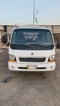 كيا حمل  ام عيون رقم بغداد موديل 2003  جاهزه  السعر  65 ت 07713434561