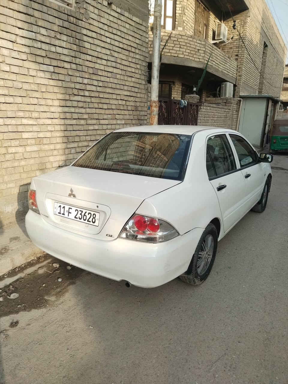 لانسر ٢٠٠٦ • ابيض • رقم بغداد