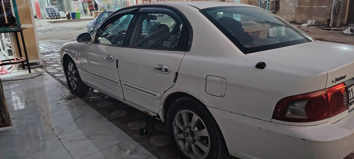 🚗 كيا أوبتيما 2006 للبيع 🚗
​المواصفات والتفاصيل:
​الموديل: 2006
​المحرك: 6 سلندر - حجم 2700 (2.7L)
​اللون: أبيض
​العجلات: ويل كب قياس 16 مع تخم تاير ياباني جديد
​الحالة العامة والخدمات:
​التبريد والتدفئة شغالة وبأفضل حالة.
​صدر أمامي وخلفي جديد بالكامل.
حادثه جاملغ الايسر من امريكا
بيه اخياس بالهلال الخلفي مثل مابين بصور
وبيه عته ب٤٠ فقط
السياره باسمي رقم انكليزي  بغداد
☐ مكاني بابل ابي غرق  
☐ ٥٥ورقه وبيه مجال وهذه رقمي  ***********
