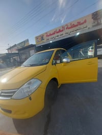 للبيع نيسان فيرسا 2009 محرك 1800 كير AT تكسي رقم نينوى صدامي . مسوي اد...