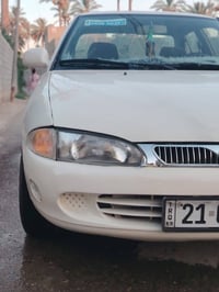 بروتون ٢٠٠٤ • ابيض • مكفولة
