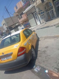 نيسان فيرسا ٢٠١٠ رقم بغداد انكليزي للبيع ٤٢ ورقه  مكاني بغداد حي الجها...