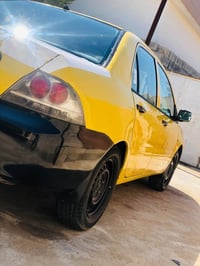 لانسر ٢٠١٠ • صفره • ضرر صندوك