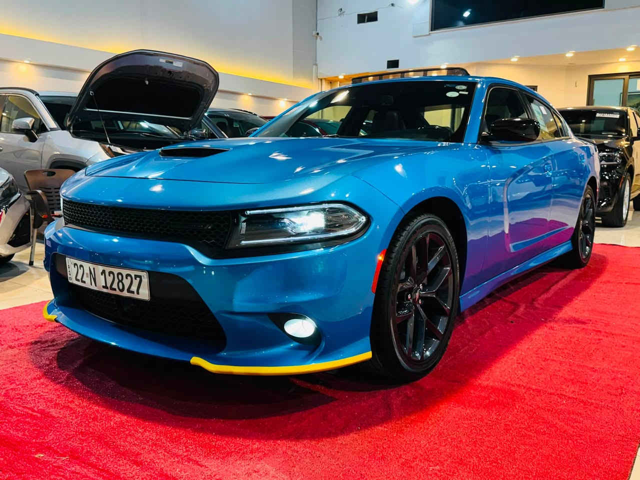 لطلب السعر علق بالرقم 1

2023 DODGE CHARGER GT PLUS 

3.6L V6 - GCC - LAST CALL ￼

مرقمة اربيل ✅

بطاقة بانزين✅

خليجي وكالة هارلم ✅❤️‍🔥

المحرك والاداء:
•  المحرك: 3.6 لتر V6 24V Pentastar - 6 سلندر ￼
•  القوة: 300 حصان ￼
•  العزم: 357 نيوتن / متر ￼
•  ناقل الحركة: 8 سرعات اوتوماتيك TorqueFlite 850RE مع Autostick و شفتات مقود ￼
•  الدفع: خلفي RWD - دفع خلفي
•  نظام التعليق: Performance Suspension مع مساعدات Bilstein رياضية و نسبة دفرنشل 3.07 ￼
•  التسارع: 0-100 تقريبا 6.4 ثانية
شنو يجي بفئة GT Plus - Plus Group:
هاي الفل الفل مال V6، مو GT العادي:
الخارجية:
•  جنوط 20 انج Black Noise اسود مطفي ￼
•  Blacktop Special Edition - كل الشبك والعلامات اسود Satin Black ￼
•  سبويلر خلفي اسود قطعة وحدة Performance Spoiler ￼
•  زنون + LED + بروجكتر ضباب Projector LED ￼
•  فتحة سقف Power Sunroof ￼
•  مرايا كهرباء مع تدفئة وذاكرة ونقطة عمياء BLIND SPOT/MEMORY/PWR/HEAT MIRRORS ￼
الداخلية والراحة:
•  مقاعد NAPPA/ALCANTARA Performance Seat جلد نابا مع الكانتارا رياضية ￼
•  مقاعد امامية تبريد وتدفئة Ventilated & Heated Front Seats ￼
•  مقاعد كهرباء مع ذاكرة وميموري للمرايا والراديو ￼
•  مقود Performance Steering Wheel تدفئة مع تحكم شفتات ￼
•  تدفئة مقود ومرايا ￼
•  شاشة 8.4 انج Uconnect مع Apple CarPlay و Android Auto ￼
•  نظام صوت Alpine بريميوم ￼
•  GPS Navigation مع Travel Group ￼
•  تشغيل عن بعد Remote Start و دخول بصمة Keyless ￼
•  ديكور كاربون فايبر حقيقي Real Carbon Fiber Interior Accents ￼
انظمة الامان والاداء:
•  Blind Spot and Cross Path Detection - نظام النقطة العمياء ￼
•  Dodge Performance Pages - صفحات الاداء والـ Launch Control ￼
•  كاميرا خلفية + حساسات
•  Traction Control و ABS و Cruise Control ￼
مواصفات خليجية GCC:
تجي مجهزة Middle East Equipment Group - راديتر اكبر، تبريد اضافي للمحرك Engine Oil Cooler، وكتابات عربية على المرايا 

العنوان📍

كركوك حي الخضراء شارع المعارض
معرض هشام الحمداني لتجارة السيارات

للاستفسار☎️📞

‭***********‬ 

*********** 

‭***********‬

￼
