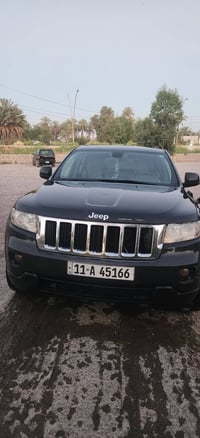 جيب كراند شيروكي ٢٠١١بغداددولي لون رمادي بإسمي محرك كير صدر اطارات تبر...
