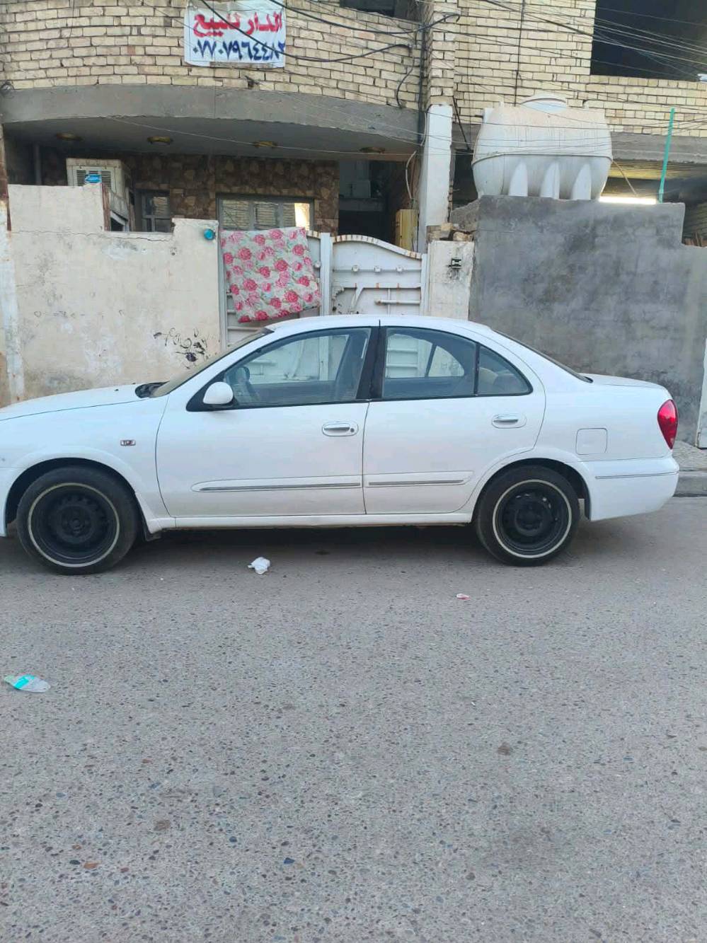 نيسان سني ياباني بس بنيد وجاملغ لايمن بي صبغ والباقي مكفول رقم واسط كير عادي محرك جديد تبريد ثلج للبيع مكاني موديل2009 سعر80وبيه مجال بغداد***********و***********