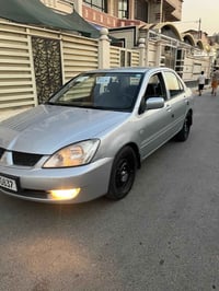 لانسر ٢٠١١ • ٢٠٠٠ سي سي • رقم بغداد