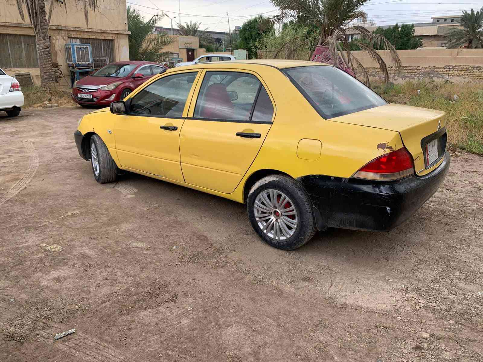 لانسر ٢٠٠٩ • محرك مكفول • رقم بغداد