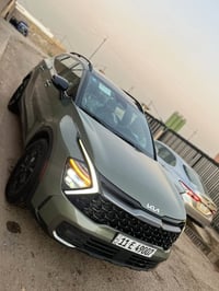 كيا سبورتج 2024 x pro 1/1 رقم بغداد باسمي لون زيتوني مميز بدون تبديل ب...