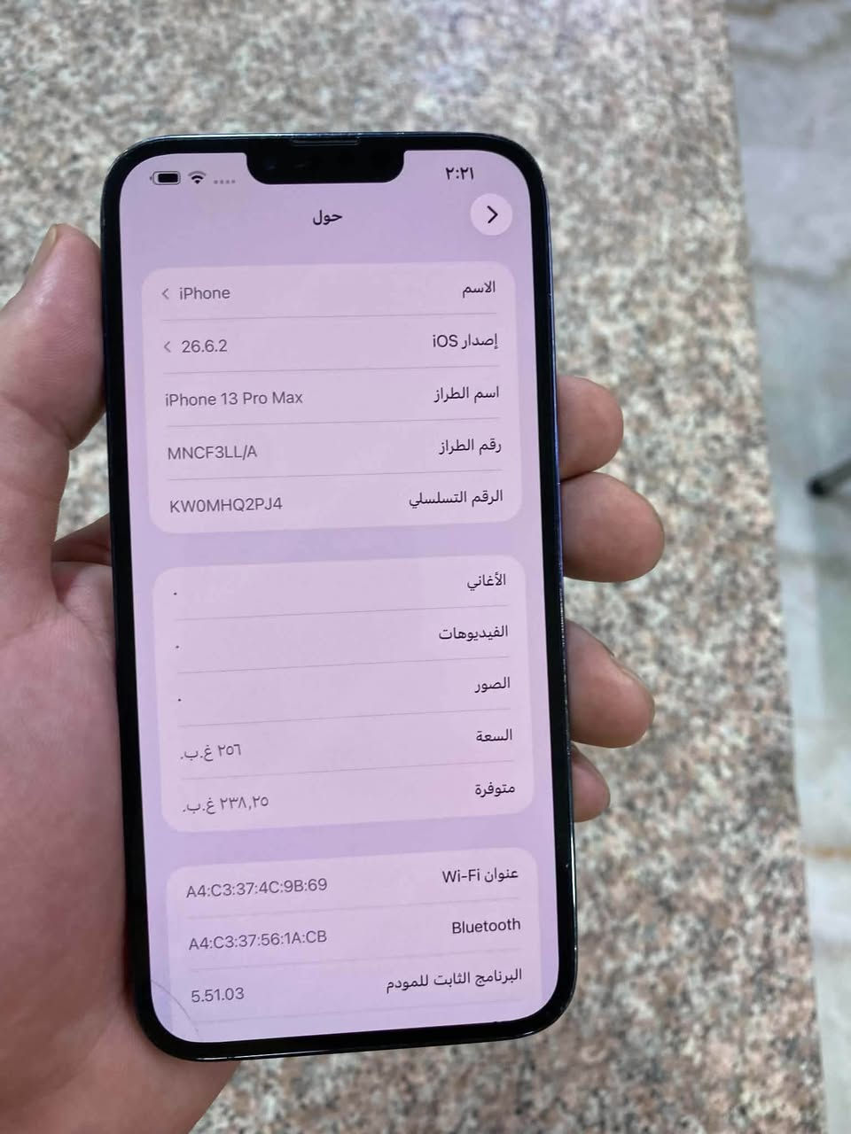 ايفون ١٣ برو ماكس مع الكارتونه نظيف جدا ذاكرة ٢٥٦ تك سيم بيه فطر من اسفل الظهر وشخط من اسفل الشاشة مامأثر نهائيا وبيه ضمان تفحصه باتري ٩٦ مصعد من دبي ضمان عبد الله سنتر نموذج M

نص مكتوب في الصور:
- ٢:٢١ حول الاسم iPhone إصدار iOS 26.6.2 اسم الطراز iPhone 13 Pro Max رقم الطراز MNCF3LL/A الرقم التسلسلي KW0MHQ2PJ4 الأغاني . الفيديوهات . الصور . السعة ٢٥٦ غ.ب. متوفرة ٢٣٨,٢٥ غ.ب. عنوان Wi-Fi A4:C3:37:4C:9B:69 Bluetooth A4:C3:37:56:1A:CB البرنامج الثابت للمودم 5.51.03