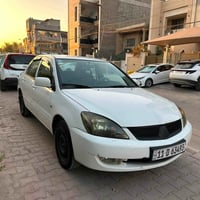 لانسر • ٢٠١١ • مكفول محرك