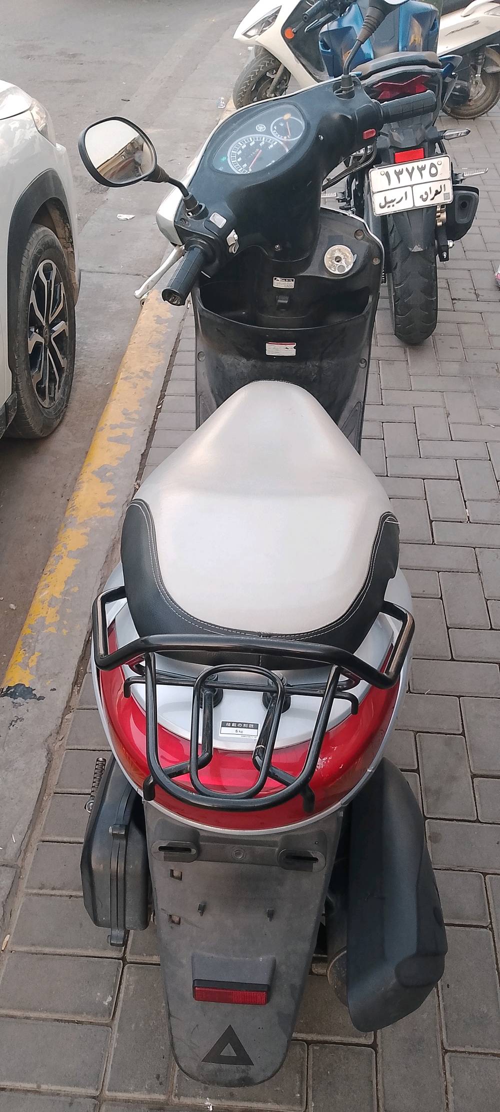 تمام، هذا بدون صورة نهائياً - انسخه مباشرة:

> للبيع دراجة ياماها سكوتر رنبة نوزل
> ياباني اصلي - نظافة فول
> السعر مليون و200 الف وبيها مجال
> المكان بغداد الكاظمية
> رقم التواصل ***********

اذا تريد اختصره اكثر للواتساب كلي.