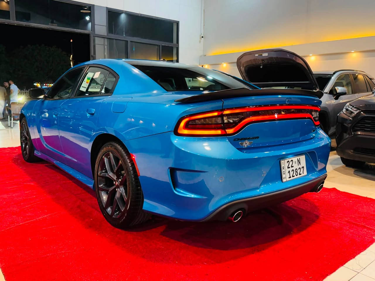 لطلب السعر علق بالرقم 1

2023 DODGE CHARGER GT PLUS 

3.6L V6 - GCC - LAST CALL ￼

مرقمة اربيل ✅

بطاقة بانزين✅

خليجي وكالة هارلم ✅❤️‍🔥

المحرك والاداء:
•  المحرك: 3.6 لتر V6 24V Pentastar - 6 سلندر ￼
•  القوة: 300 حصان ￼
•  العزم: 357 نيوتن / متر ￼
•  ناقل الحركة: 8 سرعات اوتوماتيك TorqueFlite 850RE مع Autostick و شفتات مقود ￼
•  الدفع: خلفي RWD - دفع خلفي
•  نظام التعليق: Performance Suspension مع مساعدات Bilstein رياضية و نسبة دفرنشل 3.07 ￼
•  التسارع: 0-100 تقريبا 6.4 ثانية
شنو يجي بفئة GT Plus - Plus Group:
هاي الفل الفل مال V6، مو GT العادي:
الخارجية:
•  جنوط 20 انج Black Noise اسود مطفي ￼
•  Blacktop Special Edition - كل الشبك والعلامات اسود Satin Black ￼
•  سبويلر خلفي اسود قطعة وحدة Performance Spoiler ￼
•  زنون + LED + بروجكتر ضباب Projector LED ￼
•  فتحة سقف Power Sunroof ￼
•  مرايا كهرباء مع تدفئة وذاكرة ونقطة عمياء BLIND SPOT/MEMORY/PWR/HEAT MIRRORS ￼
الداخلية والراحة:
•  مقاعد NAPPA/ALCANTARA Performance Seat جلد نابا مع الكانتارا رياضية ￼
•  مقاعد امامية تبريد وتدفئة Ventilated & Heated Front Seats ￼
•  مقاعد كهرباء مع ذاكرة وميموري للمرايا والراديو ￼
•  مقود Performance Steering Wheel تدفئة مع تحكم شفتات ￼
•  تدفئة مقود ومرايا ￼
•  شاشة 8.4 انج Uconnect مع Apple CarPlay و Android Auto ￼
•  نظام صوت Alpine بريميوم ￼
•  GPS Navigation مع Travel Group ￼
•  تشغيل عن بعد Remote Start و دخول بصمة Keyless ￼
•  ديكور كاربون فايبر حقيقي Real Carbon Fiber Interior Accents ￼
انظمة الامان والاداء:
•  Blind Spot and Cross Path Detection - نظام النقطة العمياء ￼
•  Dodge Performance Pages - صفحات الاداء والـ Launch Control ￼
•  كاميرا خلفية + حساسات
•  Traction Control و ABS و Cruise Control ￼
مواصفات خليجية GCC:
تجي مجهزة Middle East Equipment Group - راديتر اكبر، تبريد اضافي للمحرك Engine Oil Cooler، وكتابات عربية على المرايا 

العنوان📍

كركوك حي الخضراء شارع المعارض
معرض هشام الحمداني لتجارة السيارات

للاستفسار☎️📞

‭***********‬ 

*********** 

‭***********‬

￼
