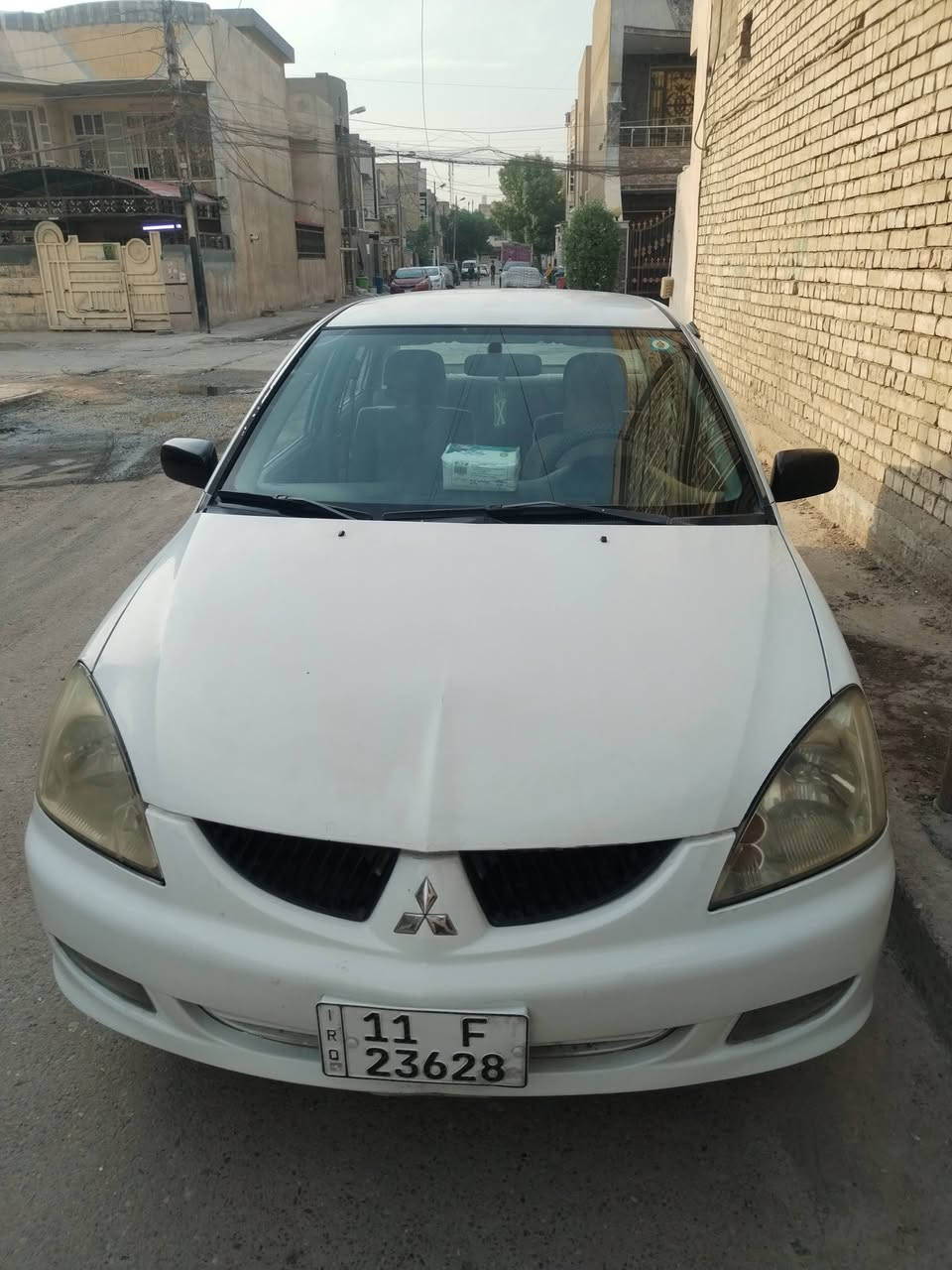 لانسر ٢٠٠٦ • ابيض • رقم بغداد