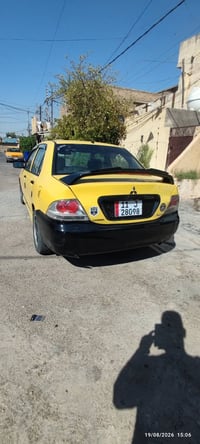 لانسر شركة عامة موديل ٢٠١٠ شادلها مكينة ٢٠٠٠  تبريد شغال سيارة بيها ضر...