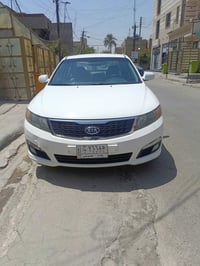 كيا لبيع 2010 كوري رقم بغداد صبغ نص جاملغ ونص باب خلفي  محرك 2000 بجم ...