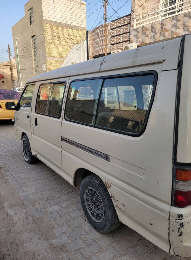 باص ١١ راكب • ٢٠٠٢ • رقم النجف