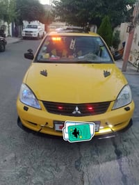 لانسر ٢٠١٠ • ميكانيك وفتيس • حالة جيدة