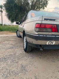 بيجو 405 • ١٩٩٢ • أصفر شمباني