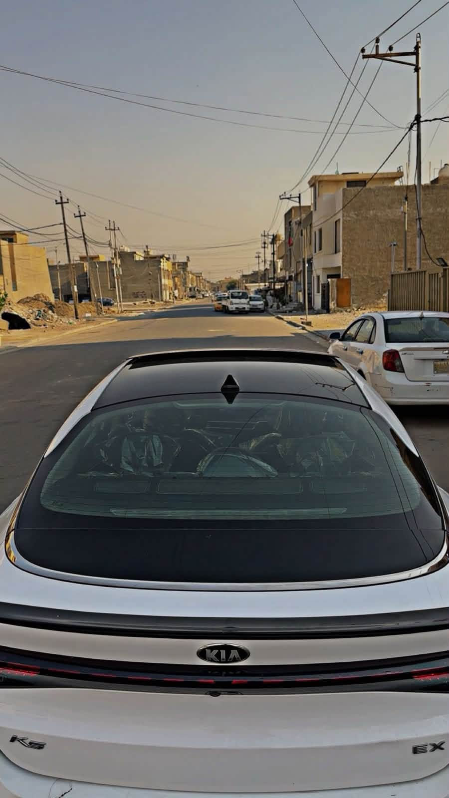 السلام عليكم حبايب 🩶
🚘 للبيع كيا K5 EX موديل 2021 فول مواصفات، اللون ابيض ، وارد أمريكي، سيارة نظيفة جداً، جاهزه ومناقصها اي شي 

✨ المواصفات:

* محرك 1Turbo 1600 

* جير أوتوماتيك 8 سرعات.

* بانوراما طكتين 

* 4 أوضاع قيادة: Smart - Custom - Sport - Normal

* قيادة شبه ذاتية (Lane Following Assist).

* مثبت سرعة ذكي (Smart Cruise Control).

* تحذير الخروج عن المسار مع تصحيح المسار.

* بريك طوارئ تلقائي (Automatic Emergency Braking).

* نظام الثبات الإلكتروني (ESC).

* نظام مانع الانزلاق (Traction Control).

* مراقبة النقطة العمياء (Blind Spot Monitoring)

* كاميرا خلفية مع حساسات أمامية وخلفية.

* شاشة كبيرة تدعم Apple CarPlay وAndroid Auto.

* نظام صوت BOSE الأصلي.

* تشغيل بصمة وبصمة أبواب (Smart Key).

* تشغيل عن بعد.

* مرايا شفط وقلاب كهربائية.

* فتحة سقف بانوراما.

* مقاعد جلد باللون الاسود 

* مقاعد أمامية كهربائية.

* تبريد وتدفئة للمقاعد الأمامية.

* تدفئة المقود.

* ميموري (Memory Seat) لمقعد السائق.

* شاحن لاسلكي.

* مكيف أوتوماتيك دبل زون.

* إنارة LED أمامية وخلفية.

* حساسات إنارة أوتوماتيكية.

* Auto Hold.

* فرامل يد إلكترونية (EPB).

* الدشبول صاجي 

📌 العداد: 75  ألف Mile.

📌 الحادث: كما موضح بالصور 

📌 السيارة بدون إيرباك، بدون لغود، بدون شواصي، وبجم كبس 

📌 رقم أربيل حره بأسمي تحويل ثاني يوم مكاني بغداد غزاليه اي استفسار *********** السعر 143
