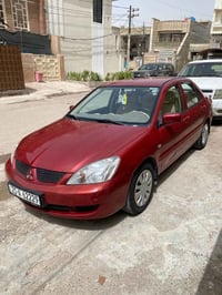 لانسر موديل2008 رقم سيلمانيه باسمي الجديد وهزه جديده ماشيه 260 الف سيا...