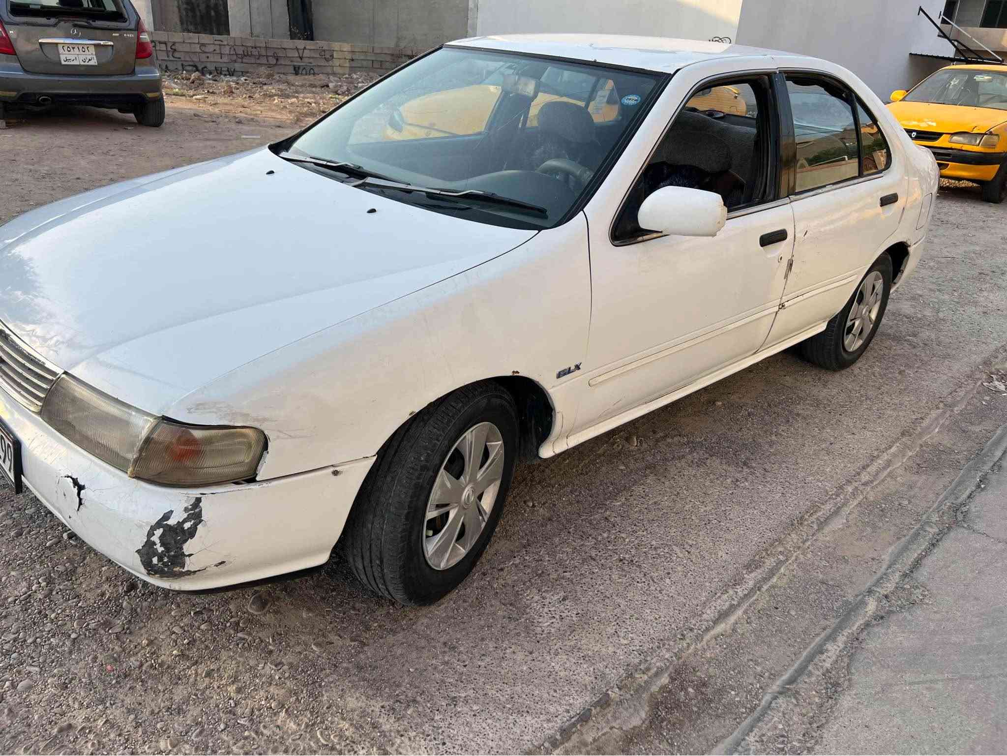 نيسان سني موديل 94 اوتماتيك كير محرك شرط 
سنويه جديد ودفتر بانزين موجود 
***********
واتساب كركوك, العراق
