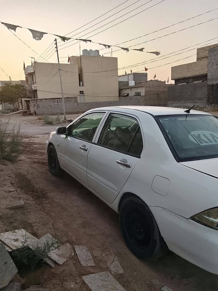 لانسر ٢٠١٠ • مصبوغة • رقم كربلاء