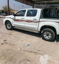 هايلوكس 2012 فورويل ماشيه 125حقيقي رقم بغداد سيارة بدون صبغ جديده مامت...