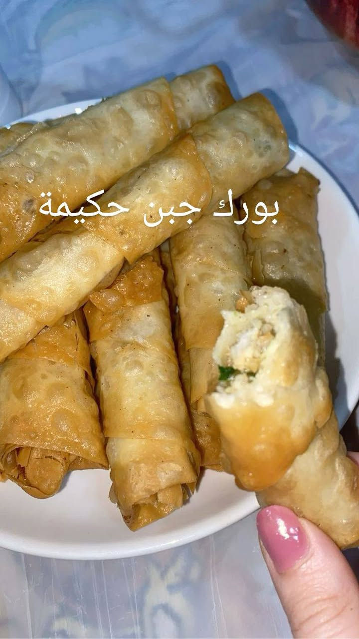 من رخصة مدير الكروب
‏🍽️ تجهيزات حكيمة.. طعم الطيبين ونَفَس البركة! ✨
‏"يا هلا بلي يلوفنا ويجرب طبخنا.. النظافة طبعنا، واللقمة السنعة لعبتنا!"
‏للاتصال على الرقم.    ***********
‏
‏لكل أهل الكيف والذوق، ولكل من يدور على عزيمة تبيض الوجه وتترس العين.. تجهيزات حكيمة تفتح لكم أبوابها بأطيب الأكلات المطبوخة بحب ونفس طويل.
‏
‏🌟 منيو البركة والخير:
‏قوزي حكيمة الفاخر: لحم ذايب ومحمر على الأصول، يقعد فوق تمن بسمتي نثري ومبهر بخلطتنا الخاصة اللي 
‏ريحتها تجيب التايه.
‏
‏كبب حكيمة البيتية (شغل إيد ونظافة عين):
‏
‏كبة حلب: مقرمشة وذهبية ومتروسة حشوة لحم فريش.
‏
‏كبة برغل وجريش: طعم أصيل يذكركم بلمة الأهل.
‏
‏كبة سلق: خفيفة، حامضة، وتعدل المزاج.
‏
‏🛑 اصناف الكبب::
‏
‏ـ١ـ كبة حلب حكيمة درجة اولة ٣٠ قطعة ب١٠ الف
‏ـ٢ـ كبة جريش سلق حكيمة ٣٠ قطعة ب١٢ الف
‏ـ٣ـ كبة بتيتة چاب حكيمة ٣٠ قطعة ب١٠ الف
‏ـ٤ـ كبة هلالية حكيمة ٤ قطع ب٦ الف
‏ـ٥ـ كبة جريش قلي حكيمة ٣٠ قطعة ب١٢ الف
‏ـ٦ـ دولمة حكيمة جدر وسط السعر ١٢الف 
‏ـ٧ـ دولمة حكيمة جدر كبير السعر ١٨ الف
‏-٨- دولمة حكيمة جدر عائلي كبير السعر ٢٤ الف
‏-٩- لحم بعجين حكيمة ٣٠ قطعة ب١٠ الف
‏-١٠- مني بيتزا حكيمة ٣٠ قطعة ب١٠ الف
‏ـ١١ـ بورك لحم حكيمة ٣٠ قطعة ب١٢ الف
‏ـ١٢ـ بورك دجاج حكيمة ٣٠ قطعة ب١٠ الف
‏ـ١٣ـ بورك جبن حكيمة ٣٠ قطعة ب١٠ الف
‏ـ١٤ـ سمبوسك لحم حكيمة ٣٠ قطعة ب١٠ الف
‏ـ١٥ـ سمبوسك دجاج حكيمة ٣٠ قطعة ب١٠ الف
‏ـ١٦ـ سمبوسك جبن حكيمة ٣٠ قطعة ب١٠ الف
‏-١٧- كباب طاوة حكيمة ٣٠ قطعة ب١١ الف
‏ـ١٨ـ كفتة حكيمة ٣٠ قطعة ب١١ الف
‏
‏
‏🟠 اصناف القوازي::
‏
‏ـ١ـ قوزي حكيمة كيلو ونص لحم عراقي هيرفي+ كيلو تمن بزمتي+ اربع انواع مرك+ سلطات+ الطرشي والخبز أو الصمون+ لبن بارد او مشروب غازي 
‏( تكفي من خمسة إلى ست اشخاص)
‏السعر ٥٠ الف
‏ـ٢ـ صينية دجاج حكيمة ثلاث دجاجات بوزن كيلو ونص للواحدة+ كيلو ونص تمن بزمتي+ مع خمسة مرك + سلطات+ طرشي والخبز أو الصمون+ لبن بارد او مشروب غازي 
‏( تكفي من ست إلى سبع اشخاص)
‏السعر ٤٥ الف
‏
‏
‏💡 شعارنا: ناكل ونوكل، والخير بيننا يدوم! أكل نظيف، ولقمة هنية تكفي مية.
‏
‏📞 للطلب والتوصيل:
‏نجهز لكم كل عزائمكم ومناسباتكم بكل حب، يرجى الطلب قبل يومين حتى يوصلكم الأكل حار وبأعلى جودة.
‏رقم الهاتف:      ***********
‏العنوان: [بغداد]
‏

