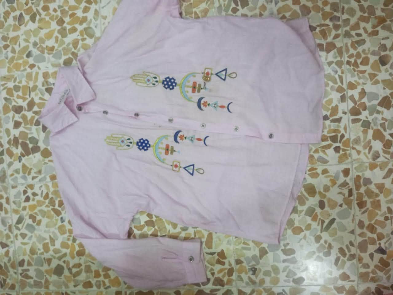 اي قطعة • ملابس